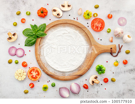 The ingredients for homemade pizza set up on white concrete background. The ingredients for homemade pizza set up on white concrete background. 100577910