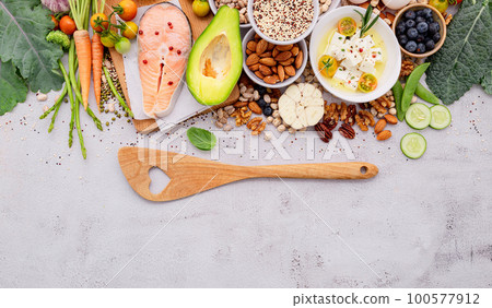Ketogenic low carbs diet concept. Ingredients for healthy foods selection set up on white concrete background. Ketogenic low carbs diet concept. Ingredients for healthy foods selection set up on white concrete background. 100577912