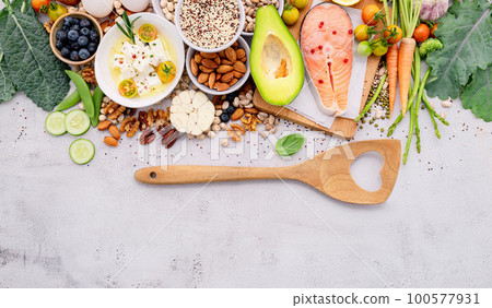 Ketogenic low carbs diet concept. Ingredients for healthy foods selection set up on white concrete background. Ketogenic low carbs diet concept. Ingredients for healthy foods selection set up on white concrete background. 100577931