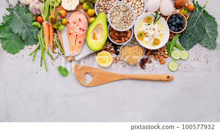 Ketogenic low carbs diet concept. Ingredients for healthy foods selection set up on white concrete background. Ketogenic low carbs diet concept. Ingredients for healthy foods selection set up on white concrete background. 100577932