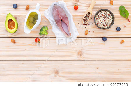 Ketogenic low carbs diet concept. Ingredients for the healthy foods selection setup on wooden background with copy space. Ketogenic low carbs diet concept. Ingredients for the healthy foods selection setup on wooden background with copy space. 100577953