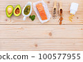 Ketogenic low carbs diet concept. Ingredients for the healthy foods selection setup on wooden background with copy space. 100577955