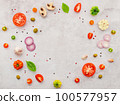 The ingredients for homemade pizza set up on white concrete background. 100577957