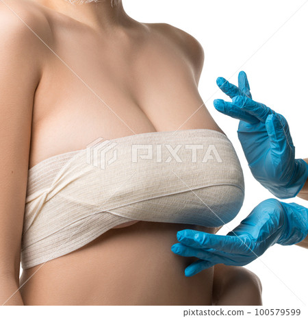 Gorgeous woman examined by plastic surgeon Gorgeous woman examined by plastic surgeon 100579599