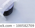 Silicon wafer inspection. A batch of silicon wafers packed in a plastic storage box in the clean room of a semiconductor foundry ready for microchip production. 100582709