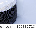 A batch of silicon wafers packed in a plastic storage box in the clean room of a semiconductor foundry ready for microchip production. 100582713