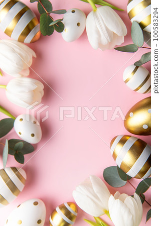 Easter golden eggs and white tulips on pink background. Easter golden eggs and white tulips on pink background. 100583294