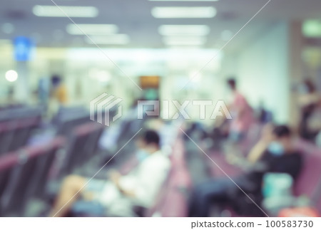 Abstract blur and defocused airport terminal interior with travelers for background. Waiting room. Abstract blur and defocused airport terminal interior with travelers for background. Waiting room. 100583730