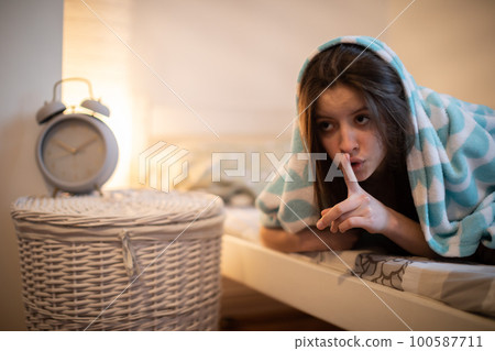 A sleep-deprived woman wants to silence her loud alarm clock. 100587711