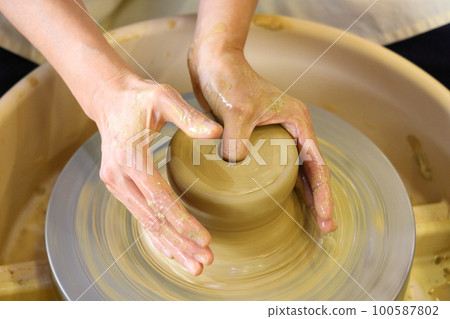 A woman doing ceramics A woman doing ceramics 100587802