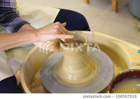 A woman doing ceramics A woman doing ceramics 100587818
