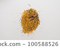 Wooden scoop with yellow lentils 100588526