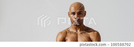 Portrait of attractive sporty man with muscled naked body on white studio background Portrait of attractive sporty man with muscled naked body on white studio background 100588702