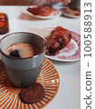 black coffee, cookies and croissant 100588913