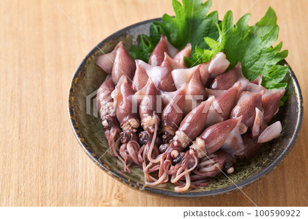 Boiled firefly squid on a plate 100590922