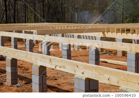 Layout of wood floor joists on concrete block foundation for new house Layout of wood floor joists on concrete block foundation for new house 100596410