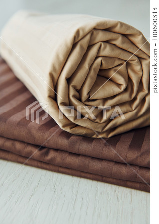 Close up view of new bedroom clothes that lying down 100600313