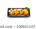 spicy salmon rolls in a plastic tray on white background 100601147