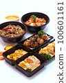 Set of Japanese food, pork rice, salmon pickle, salmon sushi rolls, and takoyaki or squid balls on white background. 100601161