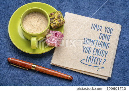 Have you done something you enjoy lately? Self care concept, note on a napkin. Have you done something you enjoy lately? Self care concept, note on a napkin. 100601710