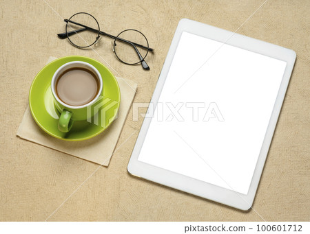mockup of digital tablet with a blank isolated screen (clipping path included) with a cup of coffee and glasses mockup of digital tablet with a blank isolated screen (clipping path included) with a cup of coffee and glasses 100601712