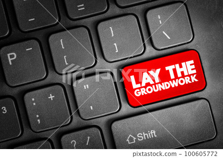 Lay The Groundwork text button on keyboard, concept background 100605772