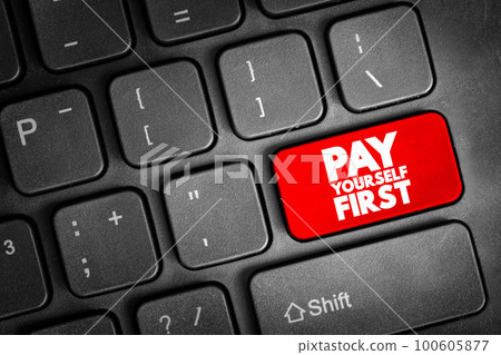 Pay Yourself First text button on keyboard, concept background 100605877