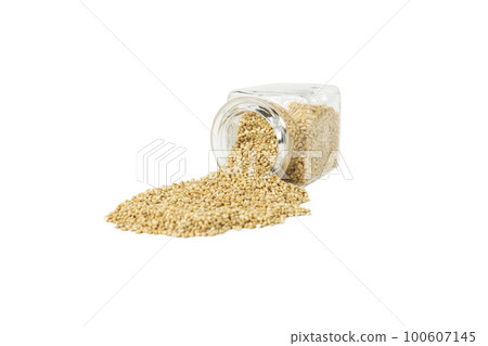 quinoa falling out of a glass jar isolated on white background. nutrition. food ingredient. quinoa falling out of a glass jar isolated on white background. nutrition. food ingredient. 100607145