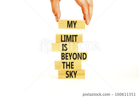 My limit is the sky symbol. Concept words My limit is beyond the sky on wooden blocks on a beautiful white table white background. Businessman hand. Business my limit is beyond the sky concept. My limit is the sky symbol. Concept words My limit is beyond the sky on wooden blocks on a beautiful white table white background. Businessman hand. Business my limit is beyond the sky concept. 100611351