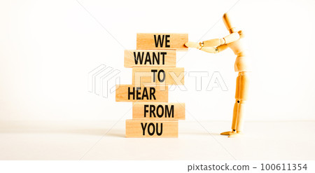 Support symbol. Concept words We want to hear from you on wooden blocks. Beautiful white table white background. Businessman icon. Business support we want to hear from you concept. Copy space. 100611354