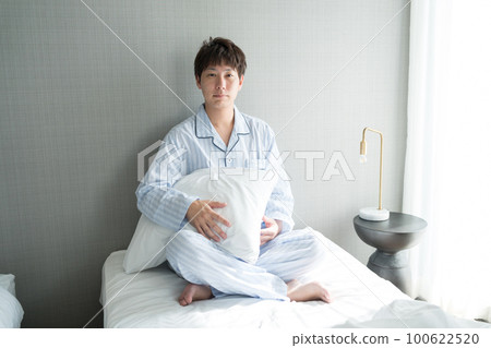 A man in his 40s in the bedroom A man in his 40s in the bedroom 100622520