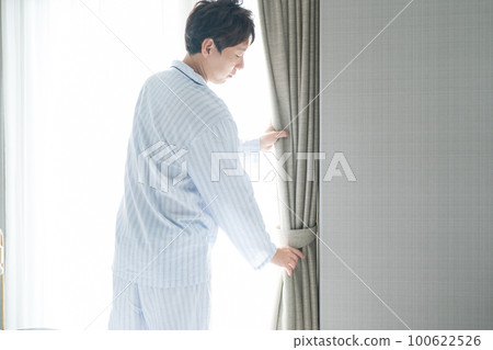 A man in his 40s in the bedroom A man in his 40s in the bedroom 100622526