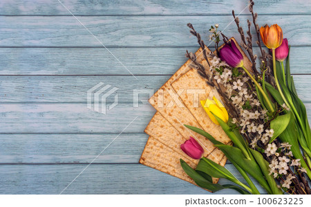 Passover matzoh jewish holiday bread over wooden table. 100623225