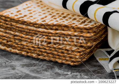 Passover matzoh jewish holiday bread over wooden table. 100623227