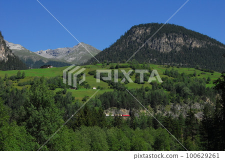 A Rhaetian Bahn train near Filisur, Switzerland 100629261