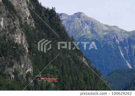 A Rhaetian Bahn train near Filisur, Switzerland A Rhaetian Bahn train near Filisur, Switzerland 100629262