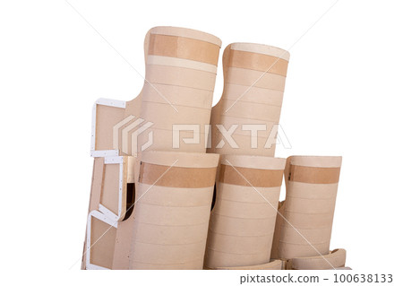 A stack of chair bodies on a trolley is prepared for moving to the upholstery shop. 100638133