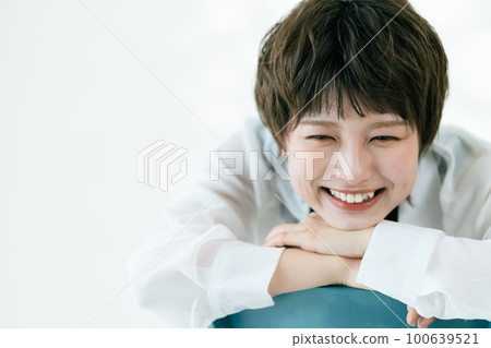 young woman smiling portrait 100639521