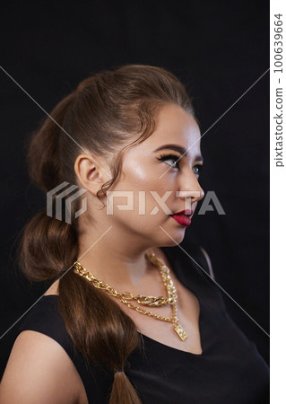 portrait shot of a young Ukrainian woman on the background, after make-up and hairstyle, for clothing advertising 100639664