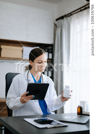Medical technology concept. Doctor working with mobile phone and stethoscope in office. 100639766