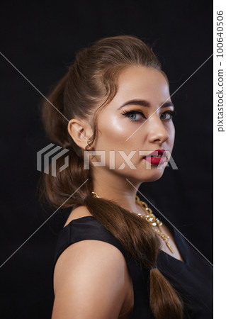 portrait shot of a young Ukrainian woman on the background, after make-up and hairstyle, for clothing advertising portrait shot of a young Ukrainian woman on the background, after make-up and hairstyle, for clothing advertising 100640506