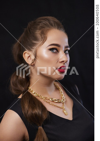 portrait shot of a young Ukrainian woman on the background, after make-up and hairstyle, for clothing advertising portrait shot of a young Ukrainian woman on the background, after make-up and hairstyle, for clothing advertising 100640508