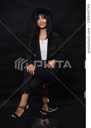 portrait shot of young happy asian or vietnamese woman, enjoying lifestyle, joy, happiness, photo on black background. portrait shot of young happy asian or vietnamese woman, enjoying lifestyle, joy, happiness, photo on black background. 100640749