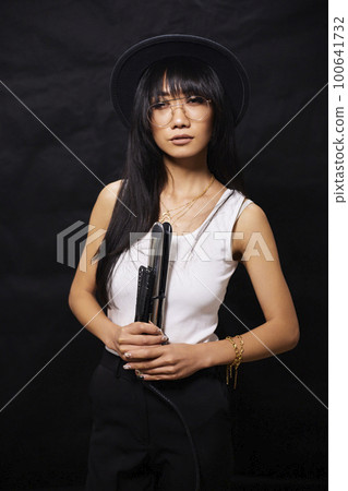 portrait shot of young happy asian or vietnamese woman, enjoying lifestyle, joy, happiness, photo on black background. portrait shot of young happy asian or vietnamese woman, enjoying lifestyle, joy, happiness, photo on black background. 100641732
