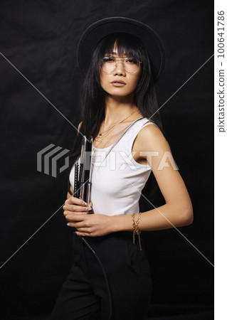 portrait shot of young happy asian or vietnamese woman, enjoying lifestyle, joy, happiness, photo on black background. 100641786