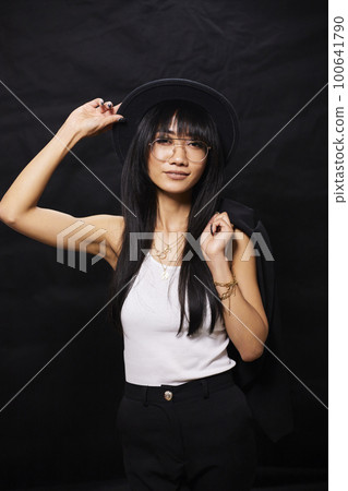 portrait shot of young happy asian or vietnamese woman, enjoying lifestyle, joy, happiness, photo on black background. 100641790