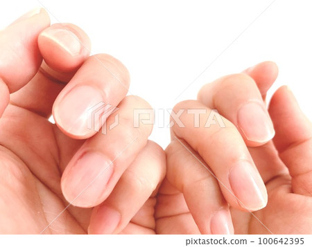 A woman's hand showing the nails of both hands A woman's hand showing the nails of both hands 100642395