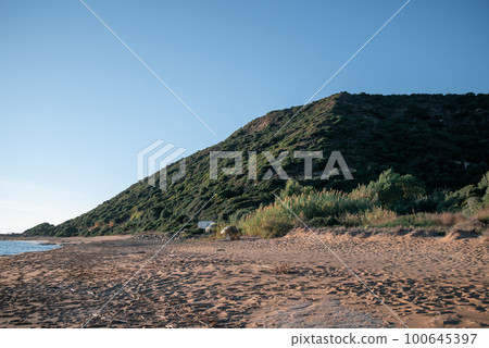 Kounoula Sandy Beach and Mountain, Corfu, Greece. Kounoula Sandy Beach and Mountain, Corfu, Greece. 100645397