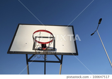 Basketball Court in the summer sunset Basketball Court in the summer sunset 100647517