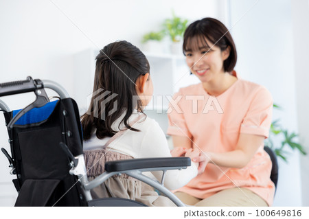 Wheelchair child medical examination 100649816